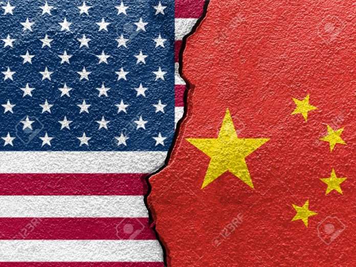 84578203-u-s-a-and-china-s-flags-on-cracked-wall-concept-of-international-conflict-