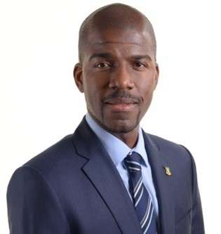 Photo of Eliezer Benito Wheatley, medium headshot, facing the camera with his body slightly tilted left